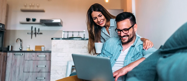 Younger couple researching PPO and HMO dental insurance plans