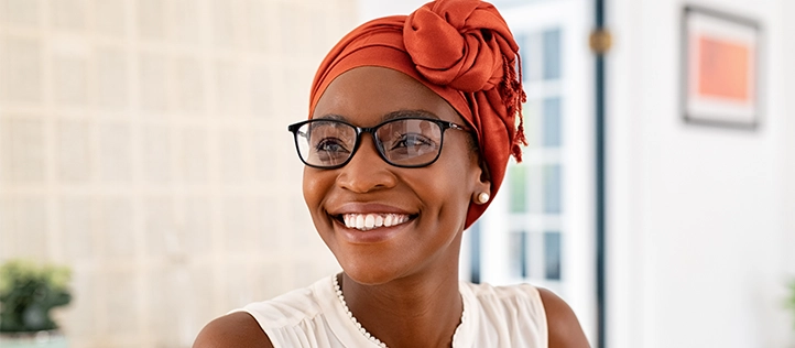Young woman smiling while wearing glasses