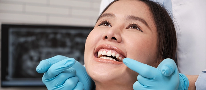 Female patient in dentist chair for an implant