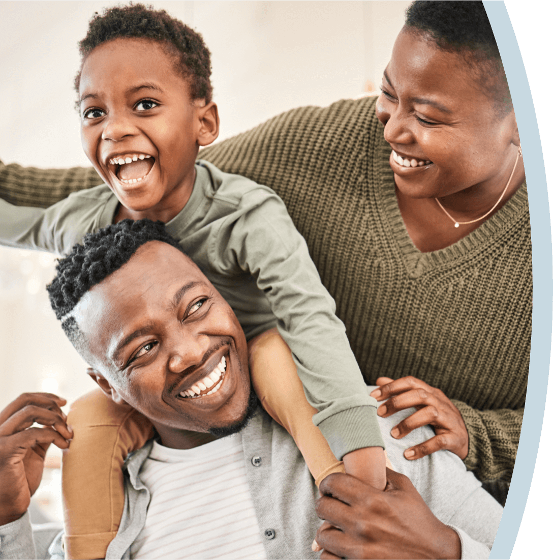 A family smiling together after finding the right dental plan