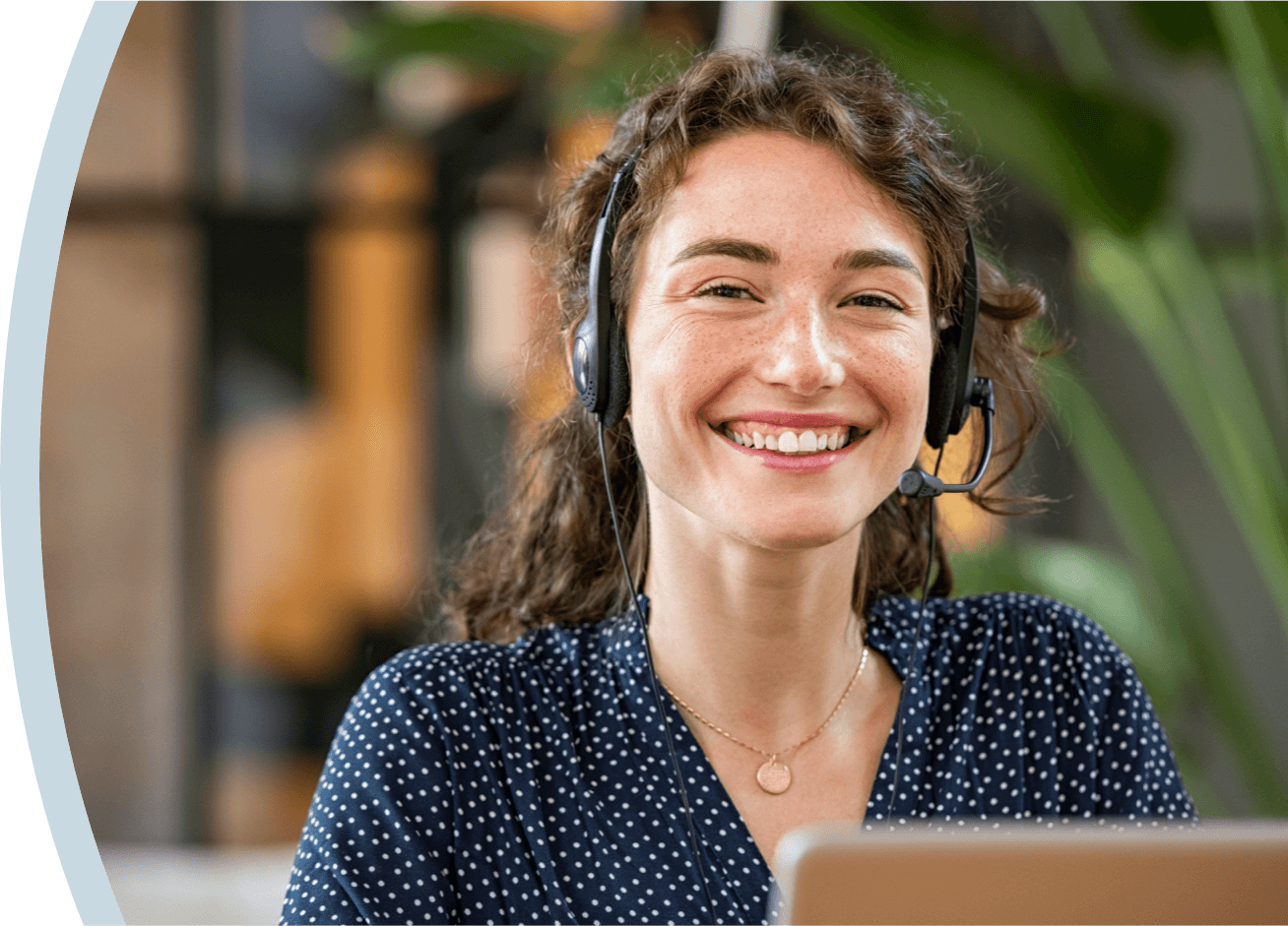 A smiling customer support representative from Spirit Dental