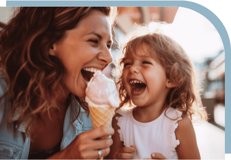 A mom and daughter eating ice cream
