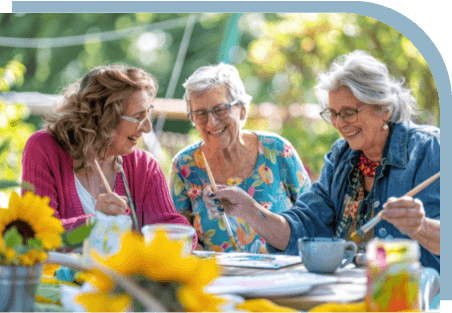 Three older ladies painting